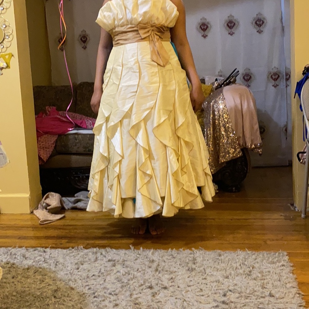 Champagne dress with light brown belt.